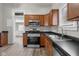 Open kitchen with stainless steel appliances and wood-look floors at 1310 California St, Columbus, IN 47201