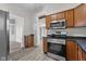 Updated kitchen with stainless steel appliances, microwave, and modern fixtures at 1310 California St, Columbus, IN 47201