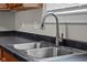 Close-up of a double stainless steel sink and stainless steel faucet at 1310 California St, Columbus, IN 47201