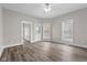 Spacious living room featuring light gray walls, new floors, and modern ceiling fan at 1310 California St, Columbus, IN 47201