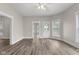 Bright living room with new floors, large windows, ceiling fan, and fresh paint at 1310 California St, Columbus, IN 47201