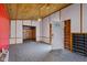 Spacious living room with paneled walls and carpet flooring at 1310 California St, Columbus, IN 47201