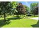 Backyard featuring trees, green grass and landscaping at 13355 Freenza Ct, Carmel, IN 46074