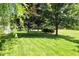 A lush backyard has mature trees with plenty of space at 13355 Freenza Ct, Carmel, IN 46074