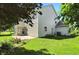 A well-maintained backyard features a patio, beautiful flower beds, and a lush lawn at 13355 Freenza Ct, Carmel, IN 46074