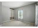 Neutral bedroom featuring built-in shelving and a bright window at 13355 Freenza Ct, Carmel, IN 46074