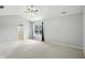 Spacious primary bedroom with neutral walls, large window and ceiling fan at 13355 Freenza Ct, Carmel, IN 46074