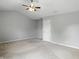 Spacious primary bedroom with neutral walls, ceiling fan and walk-in closet at 13355 Freenza Ct, Carmel, IN 46074