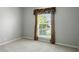 Bedroom featuring carpet, neutral walls, and a window with blinds and a patterned valance at 13355 Freenza Ct, Carmel, IN 46074