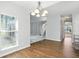 Dining room with wood floors and view of the open staircase at 13355 Freenza Ct, Carmel, IN 46074