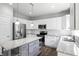 Bright kitchen featuring white cabinets, stainless steel appliances, and granite countertops at 13355 Freenza Ct, Carmel, IN 46074