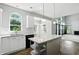Bright kitchen featuring white cabinets, stainless steel appliances, and granite countertops at 13355 Freenza Ct, Carmel, IN 46074