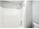 Bathroom shower featuring white tiling and showerhead at 13355 Freenza Ct, Carmel, IN 46074