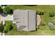 Aerial top-down view of a house featuring the roof, lawn, and wooden deck at 13992 Wynngate Ln, Fishers, IN 46038