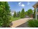 Spacious backyard features a deck, mature landscaping, and a well-manicured lawn at 13992 Wynngate Ln, Fishers, IN 46038
