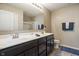 The bathroom offers double sinks with a large vanity mirror at 13992 Wynngate Ln, Fishers, IN 46038
