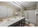 The bathroom features double sinks and neutral accents at 13992 Wynngate Ln, Fishers, IN 46038