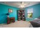 Bright bedroom shows a built-in bookshelf and large window at 13992 Wynngate Ln, Fishers, IN 46038