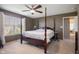 This bedroom boasts soft lighting, neutral paint, and lots of natural light at 13992 Wynngate Ln, Fishers, IN 46038