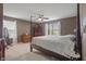 The bedroom has neutral carpet with brown walls and wooden furniture at 13992 Wynngate Ln, Fishers, IN 46038