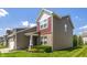 View of the home's side exterior showcasing well-maintained landscaping and architectural details at 13992 Wynngate Ln, Fishers, IN 46038