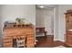Another angle of the hardwood floor and neutral colors showing an antique desk and decorations at 13992 Wynngate Ln, Fishers, IN 46038