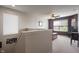 Upstairs loft area with neutral walls, carpet flooring, and a comfortable seating area at 13992 Wynngate Ln, Fishers, IN 46038
