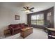 Cozy loft area featuring a sofa, a trunk-style table, and a sewing machine table at 13992 Wynngate Ln, Fishers, IN 46038