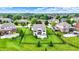 Stunning aerial view of the property showcasing the lush green lawn, mature trees, and well-maintained landscaping at 14682 Braemar E Ave, Noblesville, IN 46062