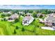 Beautiful aerial view of the property, highlighting the expansive lawn, mature trees, and well-manicured landscaping at 14682 Braemar E Ave, Noblesville, IN 46062