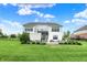 Well-maintained backyard featuring a spacious lawn, patio area, and charming landscaping, creating a private outdoor retreat at 14682 Braemar E Ave, Noblesville, IN 46062