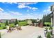 Open backyard featuring a patio, lounge chairs, a fire pit, and an expansive view of the neighborhood at 14682 Braemar E Ave, Noblesville, IN 46062