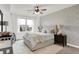 Serene bedroom with neutral tones, textured wall, and soft lighting creates a peaceful retreat at 14682 Braemar E Ave, Noblesville, IN 46062