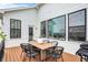 Inviting deck with an outdoor table, comfortable seating, and bright natural lighting for outdoor gatherings at 14682 Braemar E Ave, Noblesville, IN 46062