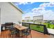 Outdoor deck with a grill and dining area, perfect for enjoying summer barbecues and scenic views at 14682 Braemar E Ave, Noblesville, IN 46062