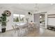 Bright dining room featuring a large window and an elegant chandelier, perfect for Gathering gatherings at 14682 Braemar E Ave, Noblesville, IN 46062