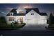 Stunning two-story home featuring a three-car garage and welcoming front porch with beautiful architectural details at 14682 Braemar E Ave, Noblesville, IN 46062