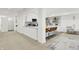 Bright kitchen featuring white cabinets, stainless steel appliances, and breakfast bar with seating at 14682 Braemar E Ave, Noblesville, IN 46062
