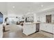 Bright kitchen with modern cabinets, an island with seating, and a seamless flow to the living area at 14682 Braemar E Ave, Noblesville, IN 46062