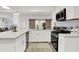 Well-equipped kitchen with sleek countertops, modern appliances, and ample natural light at 14682 Braemar E Ave, Noblesville, IN 46062