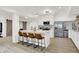 Stylish kitchen featuring an island with seating, stainless steel appliances, and modern finishes at 14682 Braemar E Ave, Noblesville, IN 46062