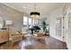 Bright living room featuring stylish furnishings, hardwood floors, and natural light; a piano adds a touch of elegance at 14682 Braemar E Ave, Noblesville, IN 46062