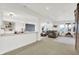 Spacious living room with a view of the kitchen area, media screen, and open layout at 14682 Braemar E Ave, Noblesville, IN 46062