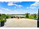 Cozy patio area with comfortable seating, ideal for relaxing and enjoying the tranquil backyard and lake scenery at 14682 Braemar E Ave, Noblesville, IN 46062