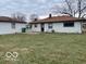 View of backyard and exterior of house. Lawn with sparse grass and detached garage at , Lebanon, IN 46052