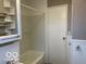 Compact bathroom featuring a shower/tub combo, vanity, and tiled walls at , Lebanon, IN 46052