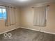 Bedroom featuring neutral walls, neutral curtains and neutral colored carpet at , Lebanon, IN 46052