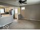 Cozy living room open to the kitchen with grey walls and a ceiling fan at , Lebanon, IN 46052