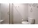 Modern bathroom features a glass-enclosed shower with a built-in seat and modern decorative elements at 17303 Lillian St, Westfield, IN 46074