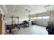 Spacious garage with workout area, storage, and an automatic door for convenience at 17303 Lillian St, Westfield, IN 46074